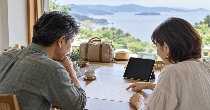 夫婦で旅行の目的に合う部屋を選ぶイメージ